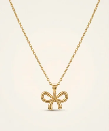 Gold plated bow pendant necklace with anti-tarnish cable chain on white background