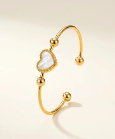 Gold plated bracelet with heart centre and pearl-like detail on sleek band for women