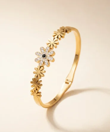 Gold plated floral bracelet with diamond finish crystals and central flower design for women