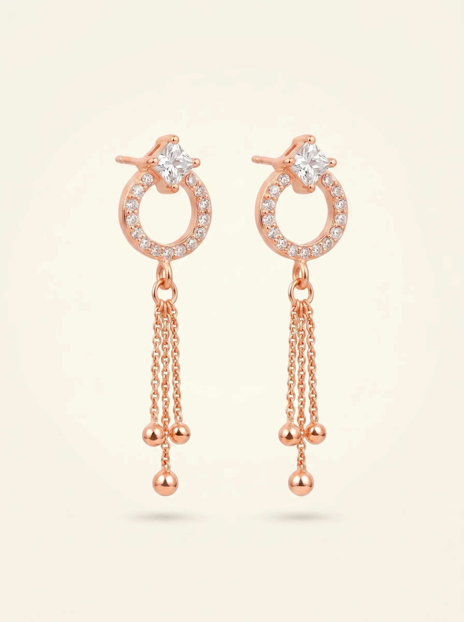 Rose gold plated drop earrings with diamond finish crystals and tassel chain detail for women