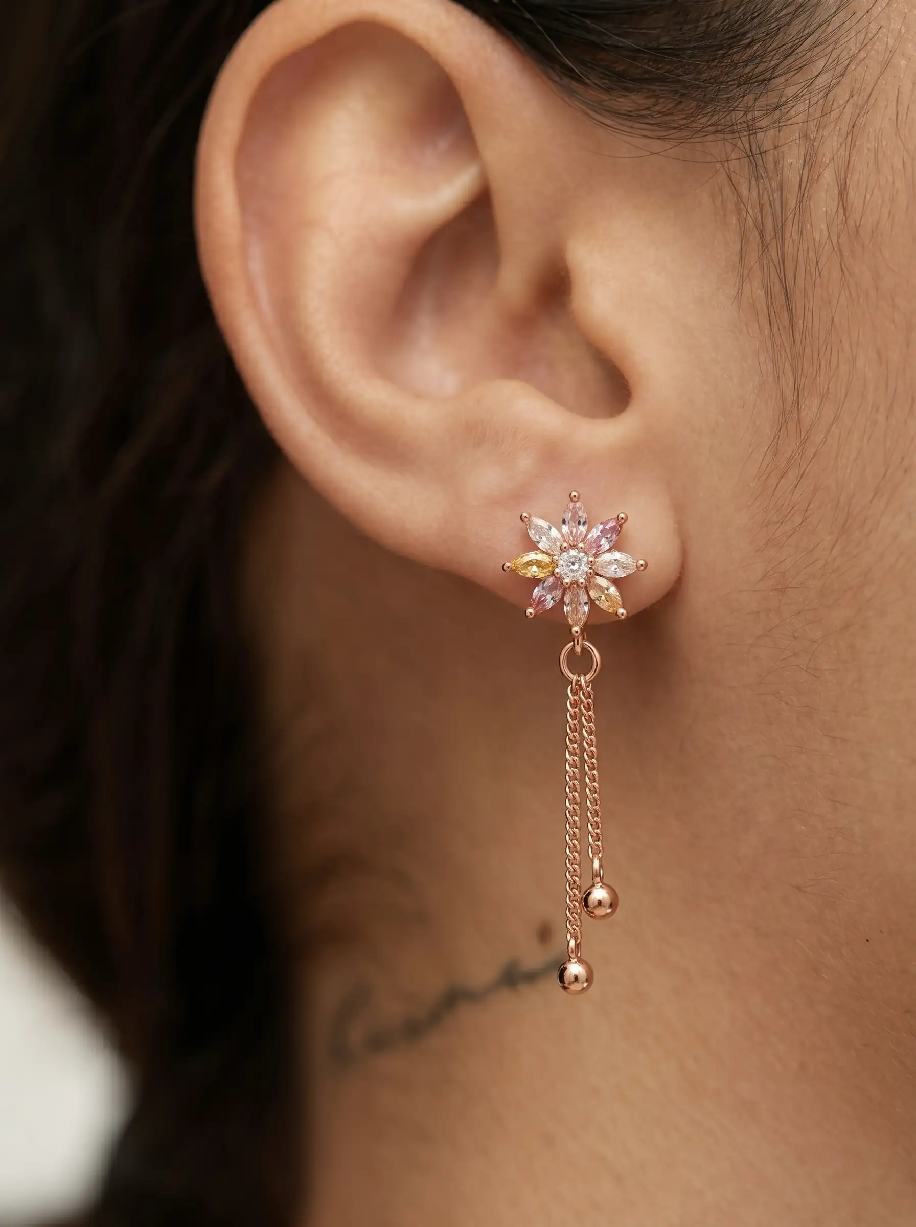 Rose gold plated floral tassel earrings with diamond finish crystals and pastel stones for women