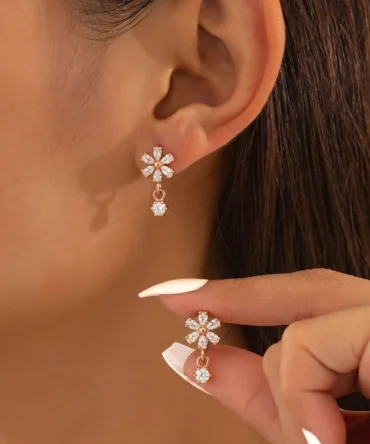 Rose gold plated floral earrings with diamond finish crystals and small drop charm for women