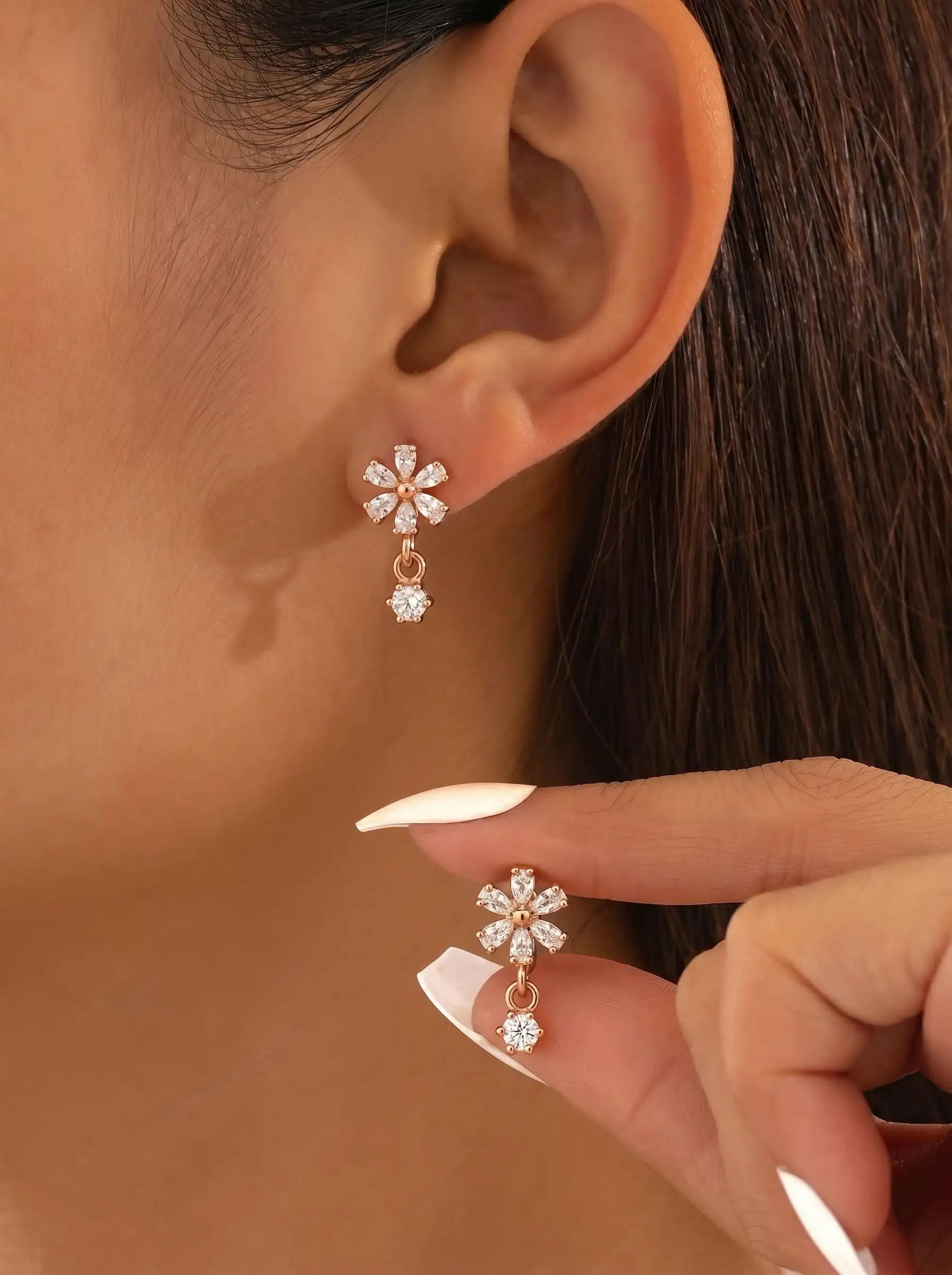 Rose gold plated floral earrings with diamond finish crystals and small drop charm for women