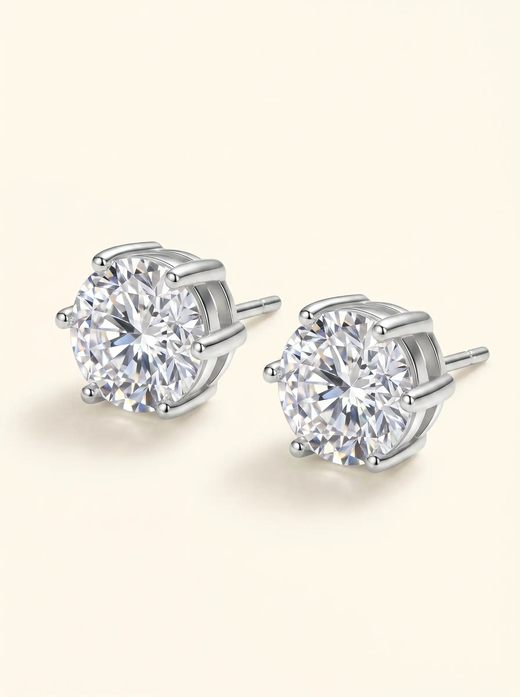 Silver tone solitaire stud earrings with round crystal and multi prong setting for women