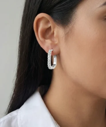 Silver tone geometric hoop earrings with crystal studded front design for women