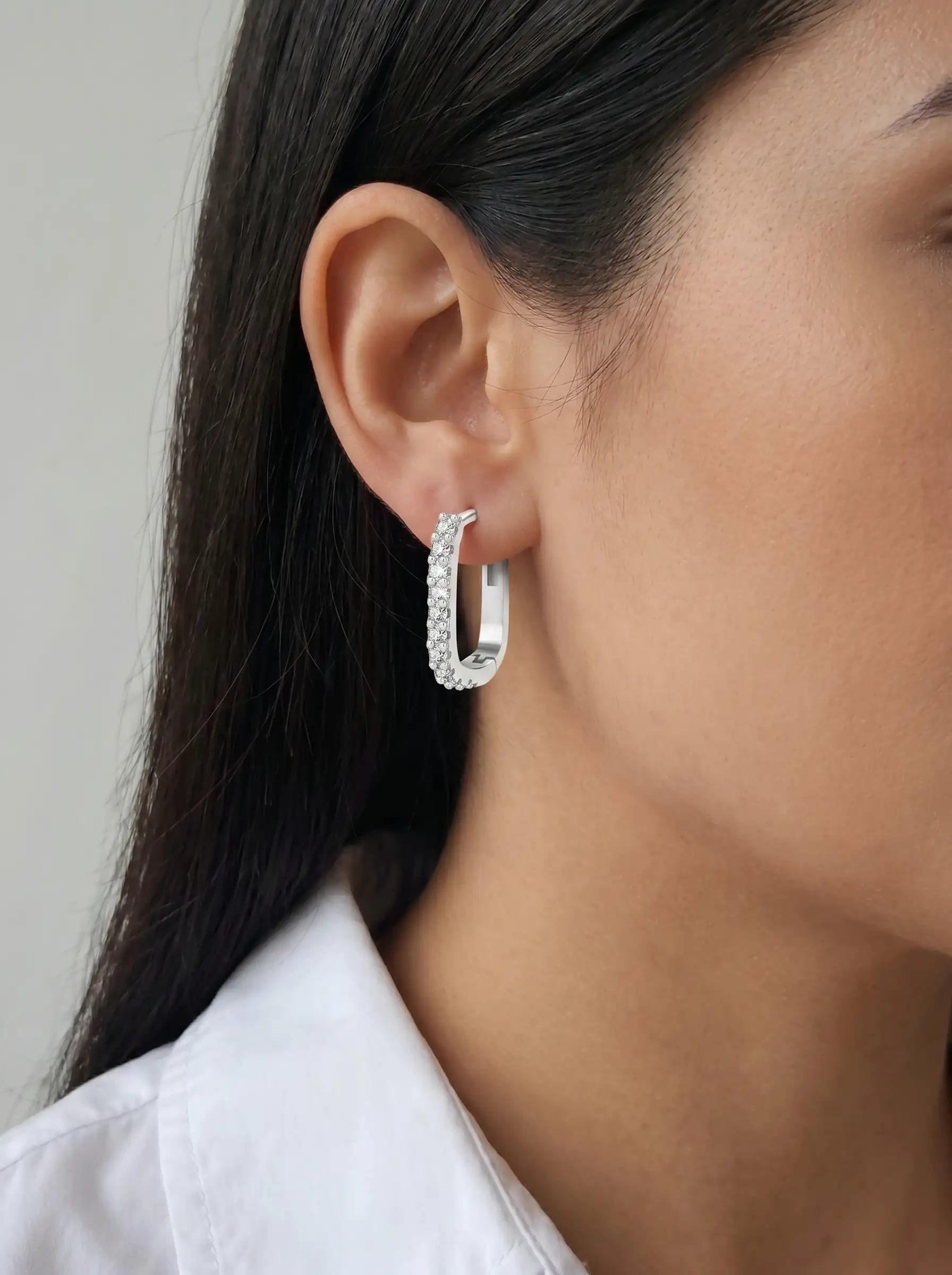 Silver tone geometric hoop earrings with crystal studded front design for women