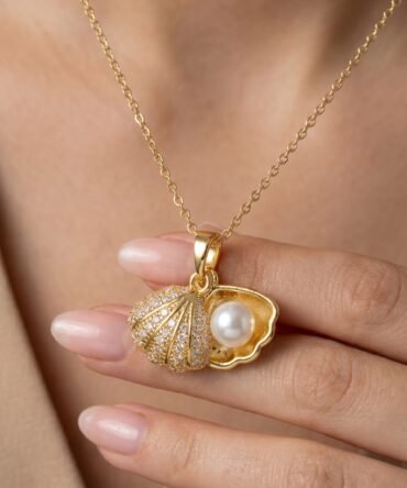 Gold plated shell pendant with crystal detailing and pearl accent on fine chain for women