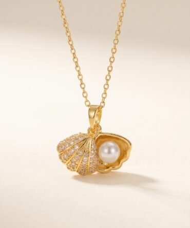 Gold plated shell pendant with crystal detailing and pearl accent on fine chain for women