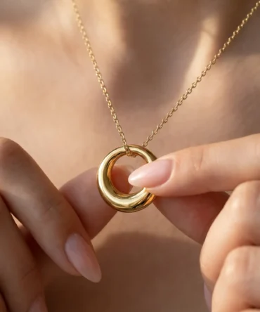 Gold tone circular pendant necklace with smooth polished geometric ring design for women