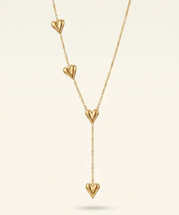 Gold tone long necklace with multiple heart pendants and drop chain design for women