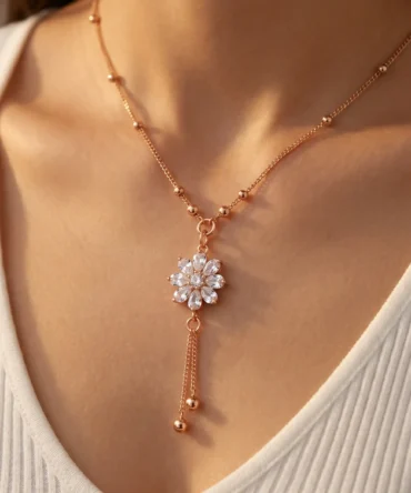 Rose gold plated floral necklace with diamond finish crystals and drop tassel chain for women