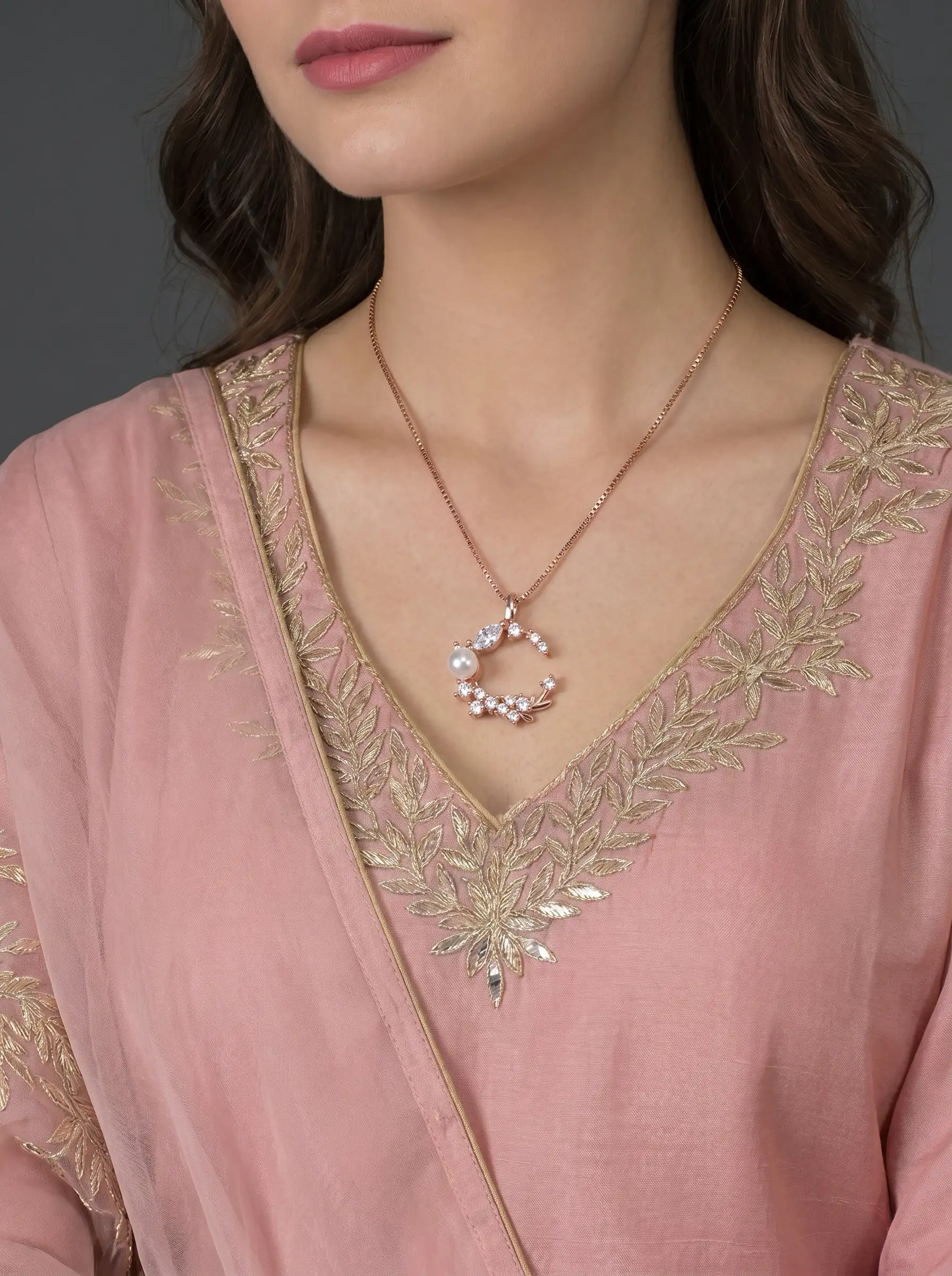 Rose gold tone moon shaped pendant with crystal cluster and pearl detail for women