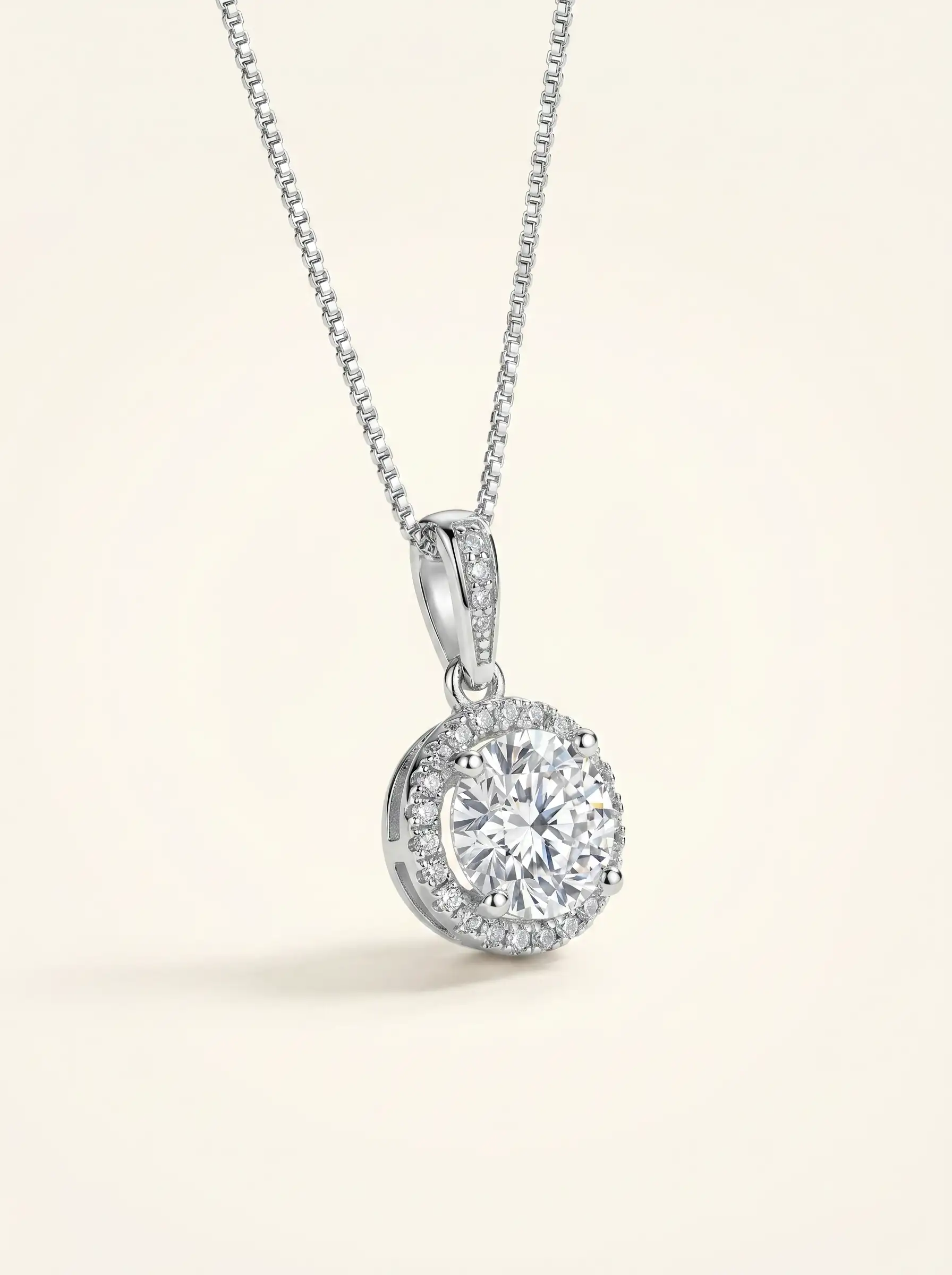 Silver tone circular solitaire pendant with crystal halo setting on chain for women