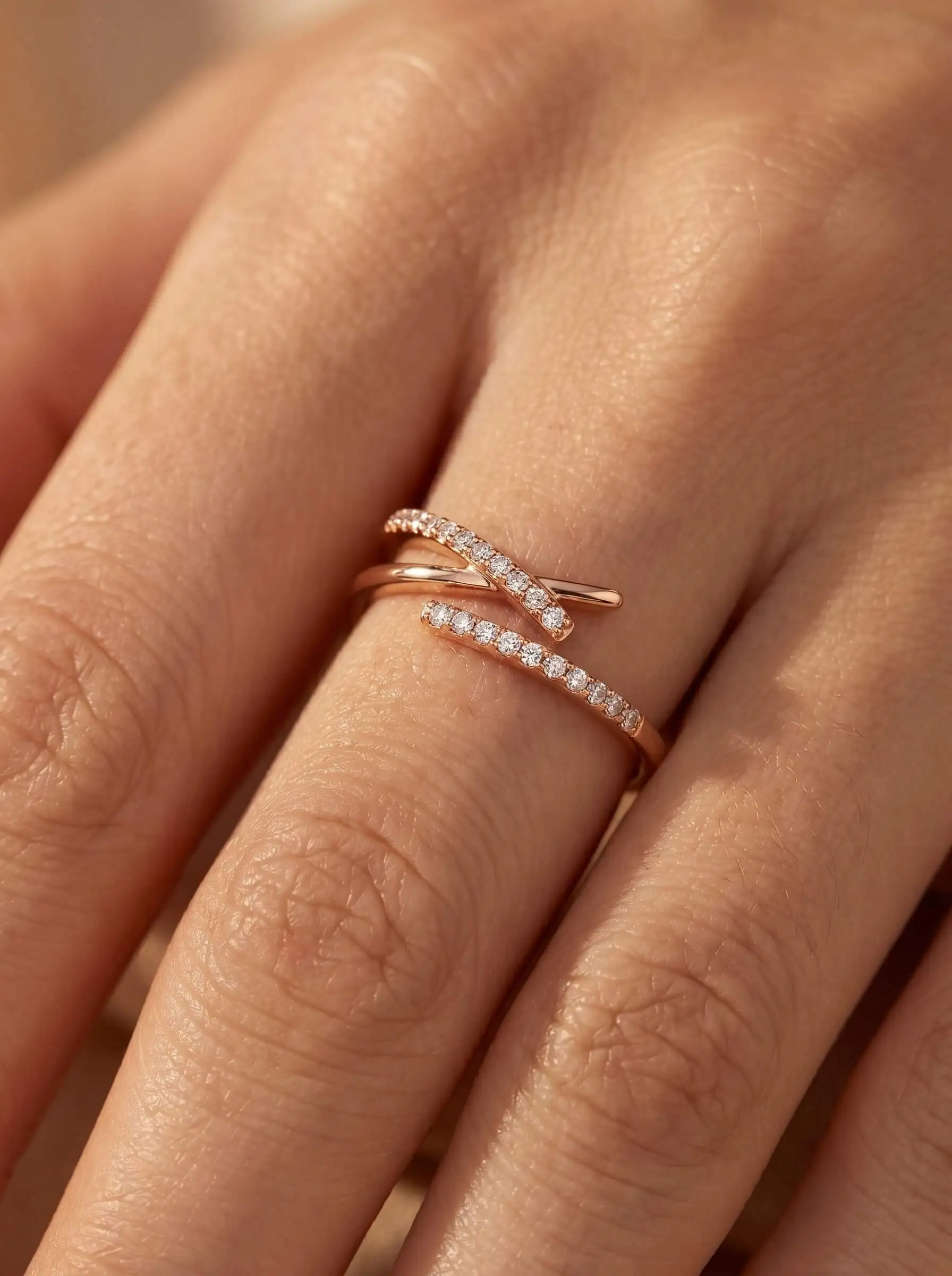 Rose gold plated adjustable crossover ring with American diamond detailing for women